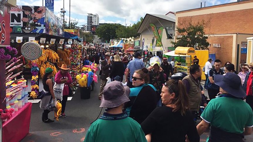 Crowds survey show merchandise on the opening day of the Ekka