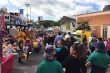 Crowds survey show merchandise on the opening day of the Ekka