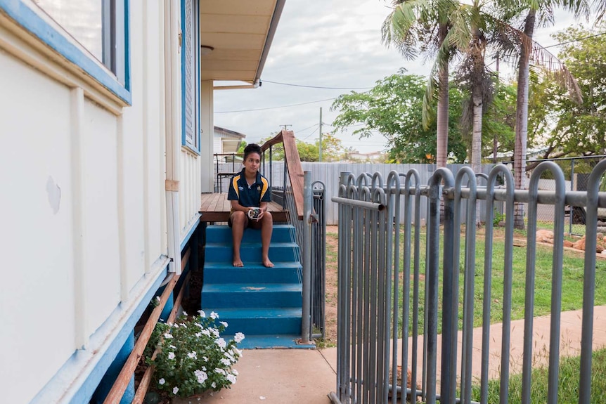 Seleena Blackley sitting on her front steps.