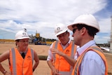 Victorian Transport Minister Jacinta Allan, Premier Daniel Andrew and Lance Brown, from GrainCorp, beside the rail freight line.