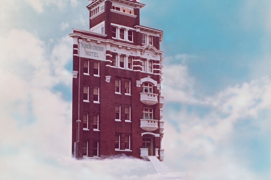Photomontage artwork of the Kings Cross Hotel facade floating in a cloudy blue sky 