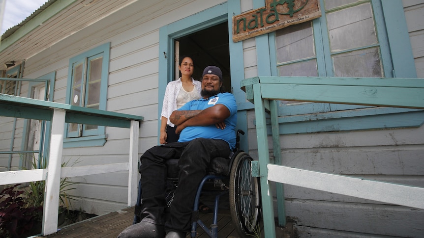 Siaosi Vaka and 'Unaloto Halafihi outside Tonga Disabled Person organisation.