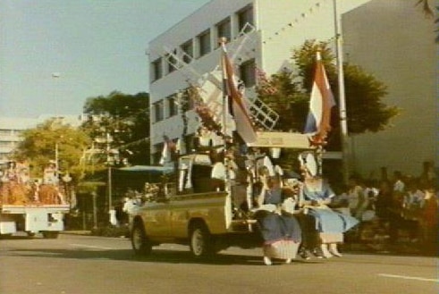 A parade float moves through Darwin at the old Bougainvillea Festival.