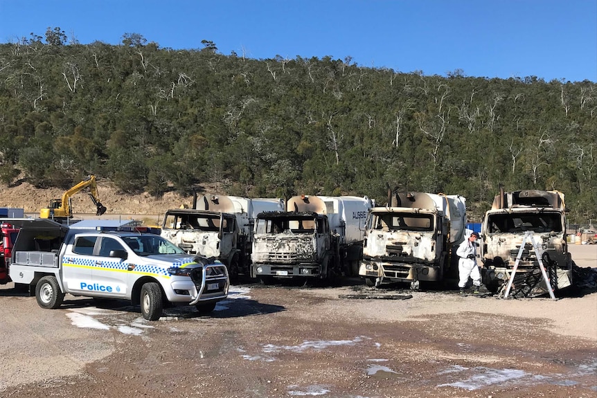 Police investigate garbage tuck fires.