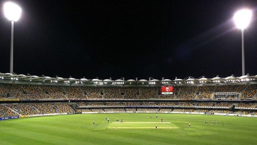 Floodlights on at the Gabba during a domestic one-dayer between Queensland and Western Australia.