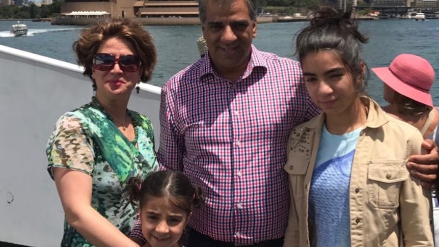 Jila Solaimani, Hedieh Rostami, Reza Rostami and Hasti Rostami stand in front of the Sydney Opera House.