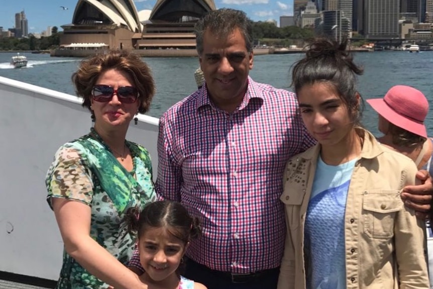 Jila Solaimani, Hedieh Rostami, Reza Rostami and Hasti Rostami stand in front of the Sydney Opera House.
