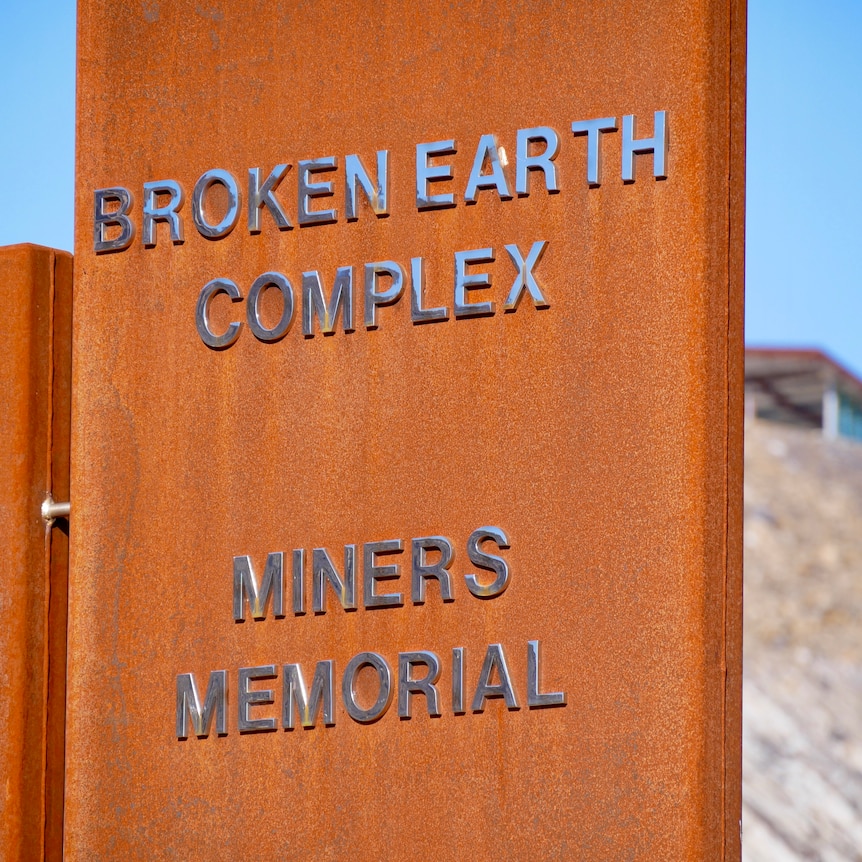 The brown sign at Broken Hill's Broken Earth Complex and Miners Memorial at the Line of Lode. 