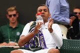 Nick Kyrgios takes a drink during a break at Wimbledon against Richard Gasquet