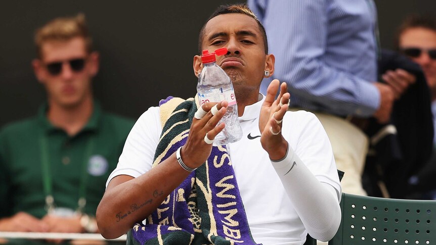 Nick Kyrgios takes a drink during a break at Wimbledon against Richard Gasquet