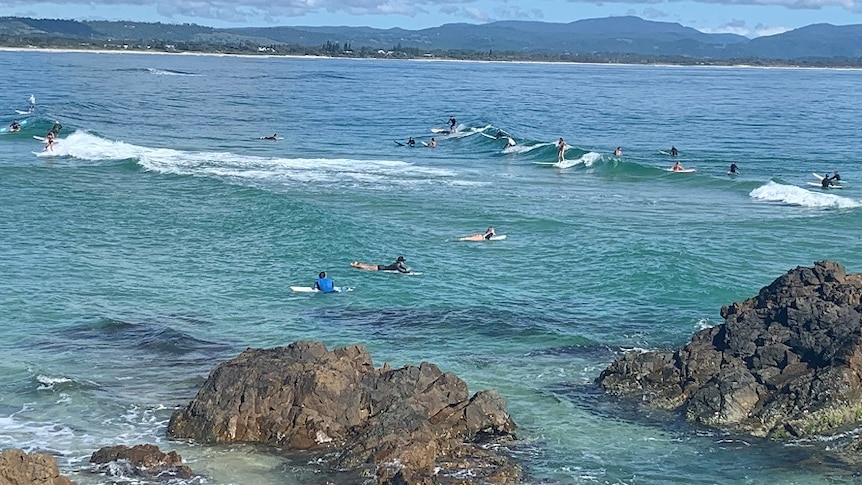Surfers at The Pass in Byron Bay during the coronavirus crisis