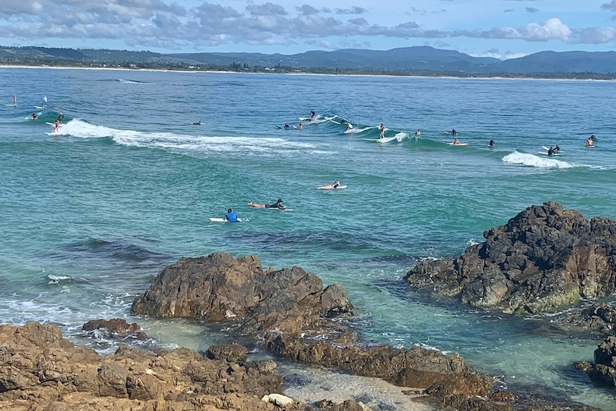 Surfers at The Pass in Byron Bay during the coronavirus crisis