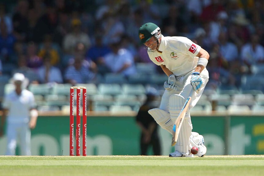Ouch... Michael Clarke doubles over after being hit in the groin.