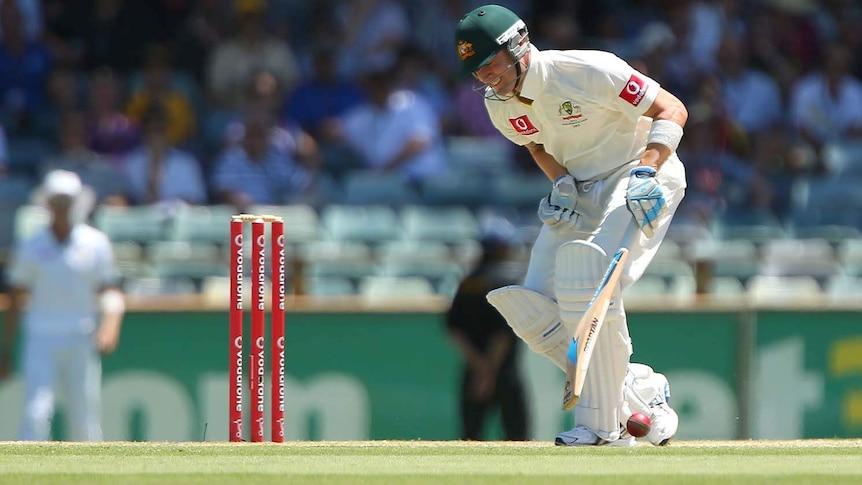 Ouch... Michael Clarke doubles over after being hit in the groin.
