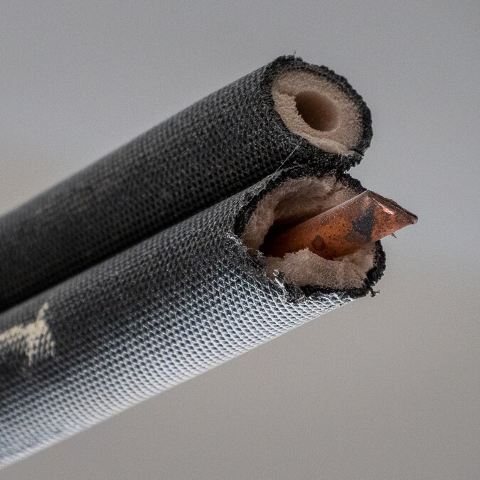 close up of copper coming out of pipe