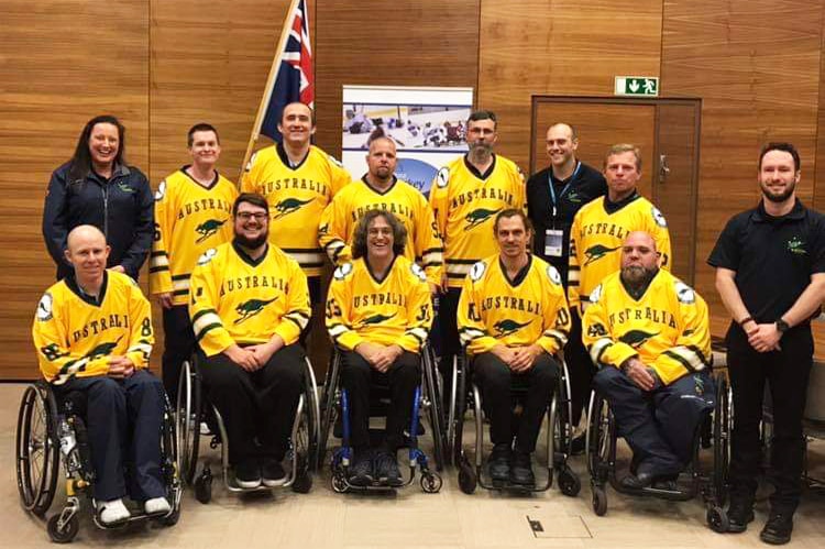 Group photo of Darren Belling (front row, 3rd from left) with his Australian Para-ice hockey team mates, date unknown.