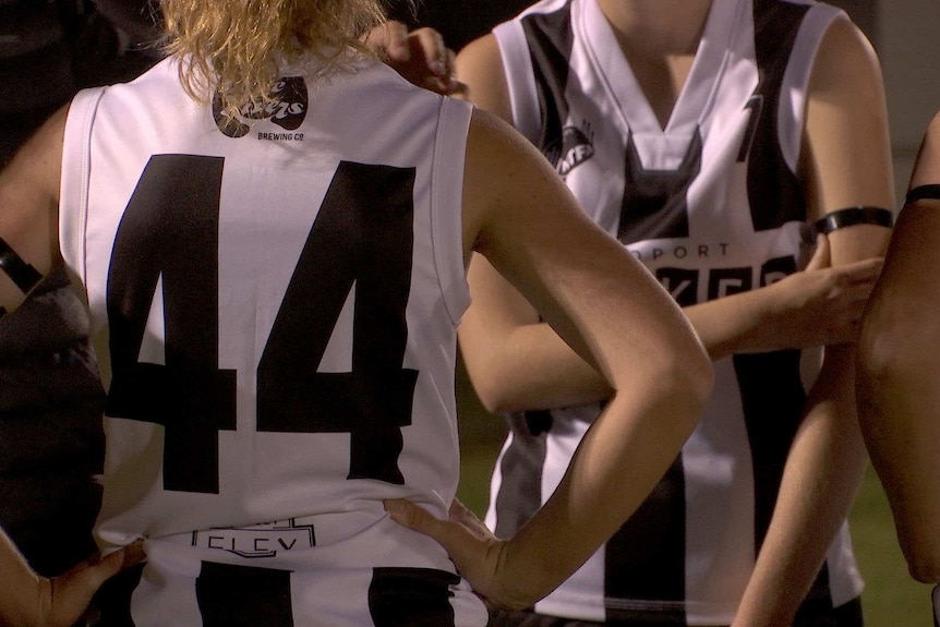 Alex Hall wearing the same number her father did for the Scottsdale football club