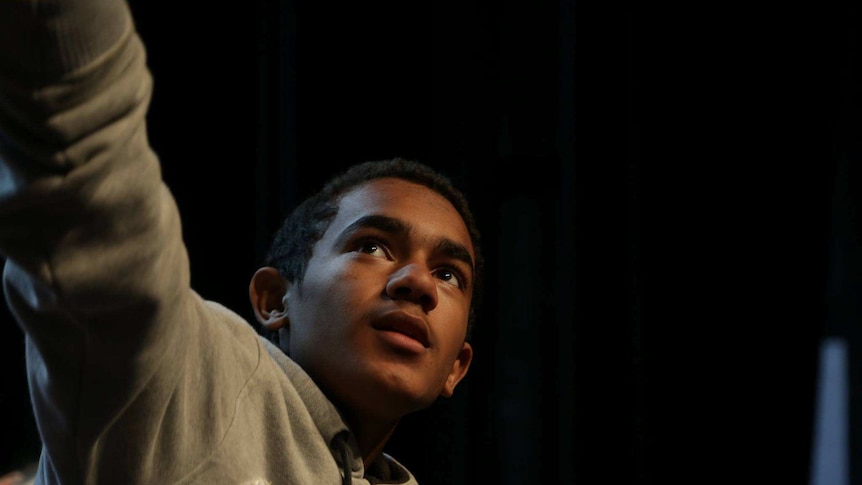 A boy acting on stage