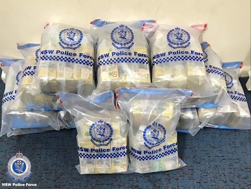$50 notes bundled and inside NSW Police Force plastic evidence bags.