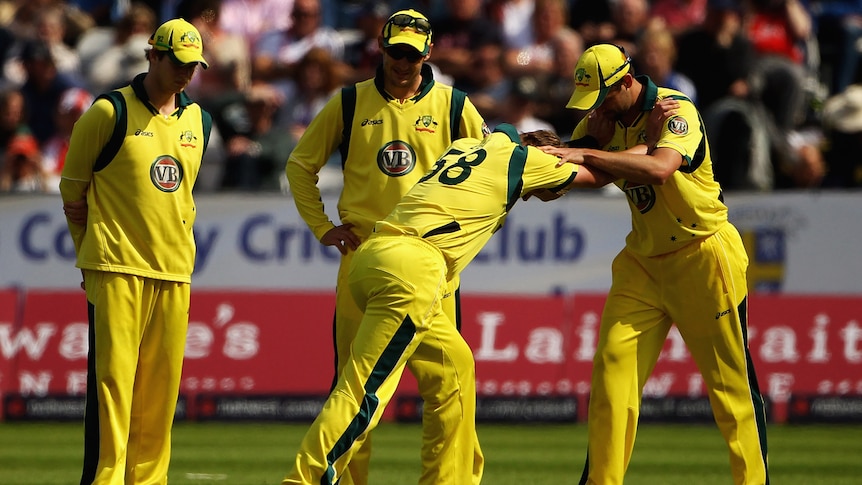 Brett Lee stretches after damaging his calf in the one-day series in England.