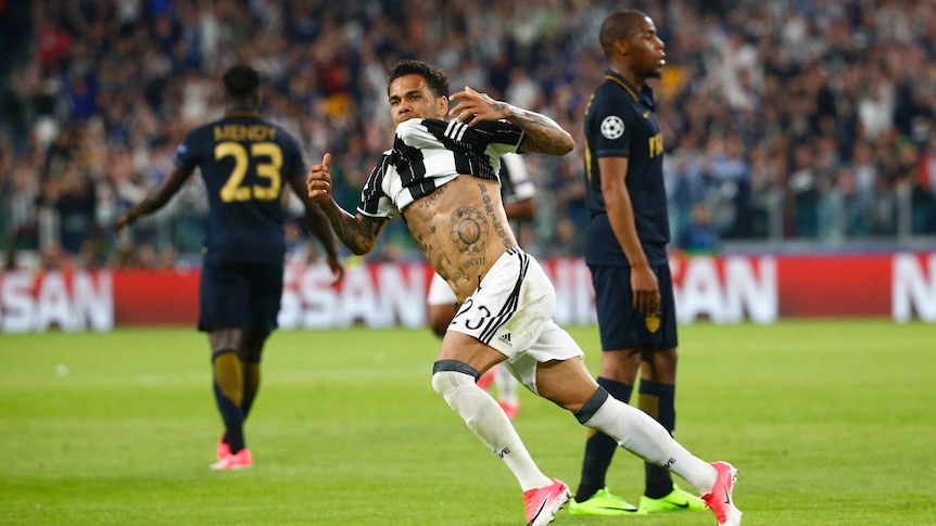Dani Alves celebrates scoring the second goal for Juventus in the Champions League semi-final.