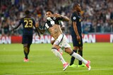 Dani Alves celebrates scoring the second goal for Juventus in the Champions League semi-final.