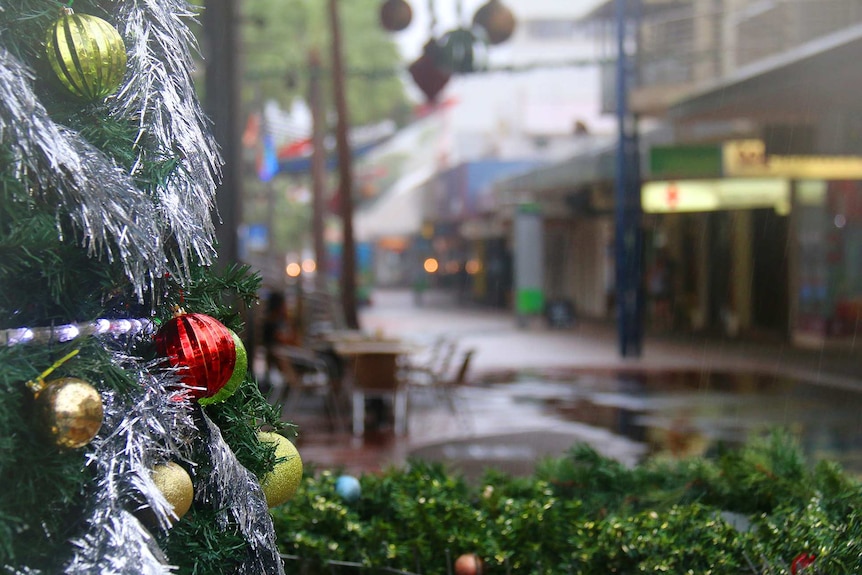 A wet and deserted Darwin city mall on Christmas Eve, as a monsoon trough brings wet weather to the Top End.