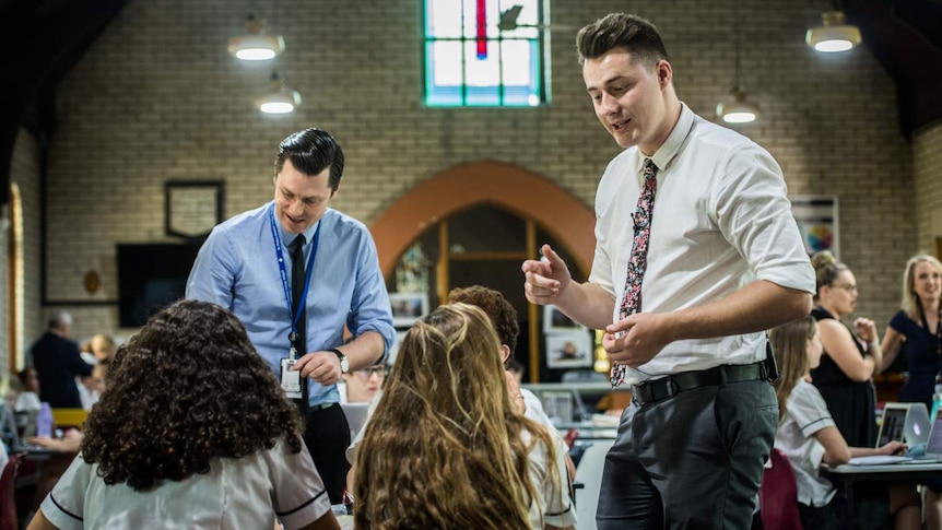 Austin Ward (right) a teaching school student is seen working with his mentor Robert Stuart in an old church