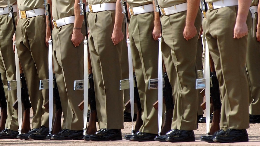Australian soldiers stand to attention