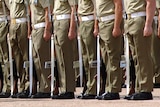 Australian soldiers stand to attention