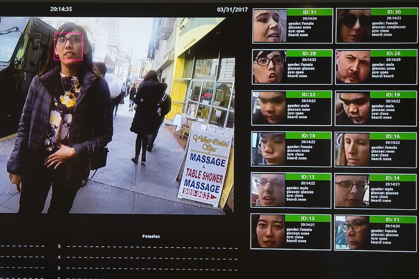 A woman has her face scanned by facial recognition software.