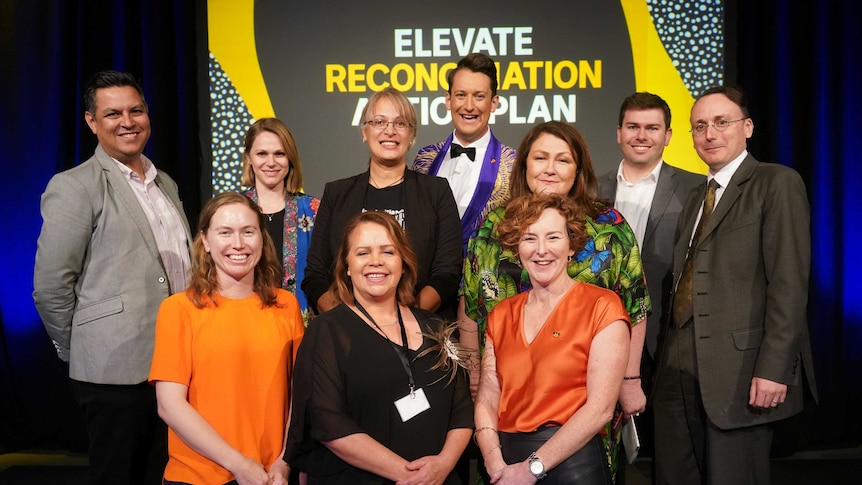 10 members of the Bonner Committee smiling at the Reconciliation Action Plan conference