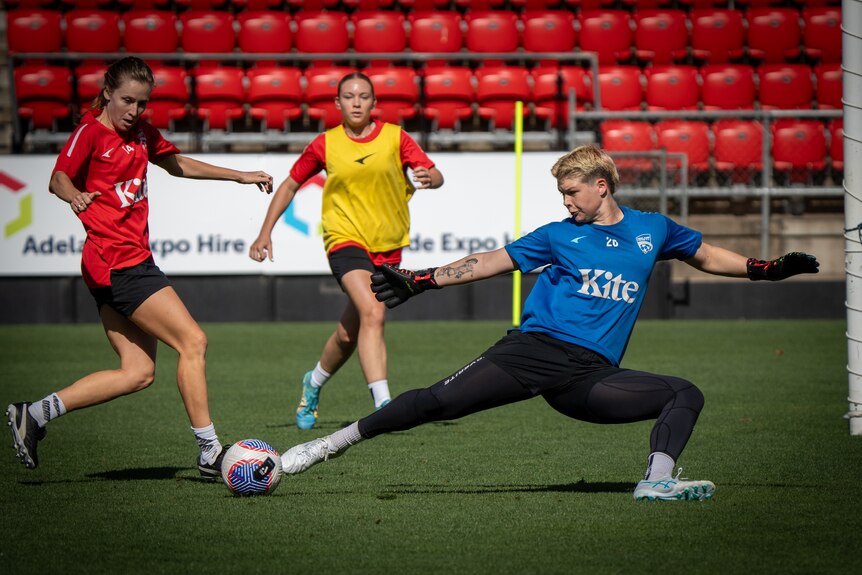 Grace Wilson kicks a soccer ball.