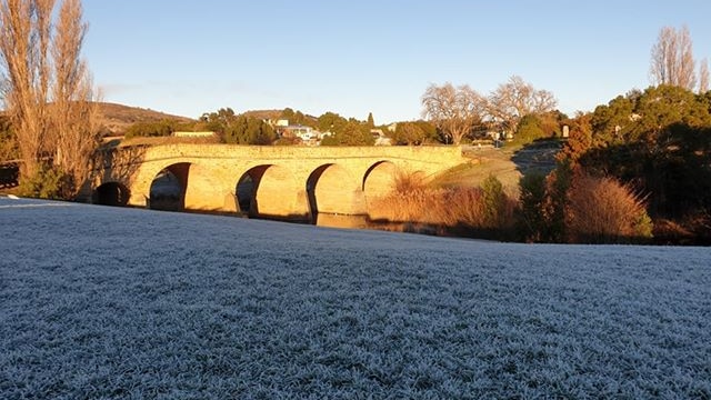 Frost on the grass opposite the Richmond Bridge in Tasmania, June 2019