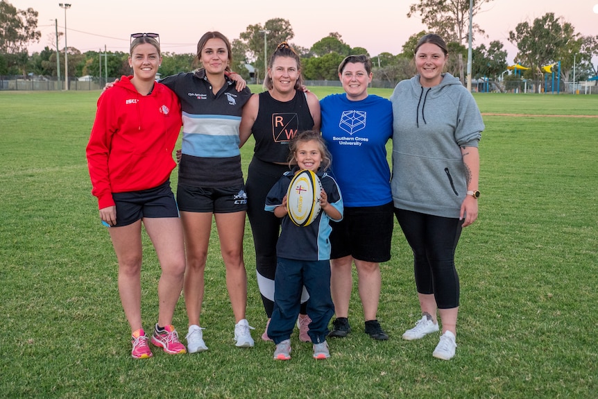 The Bourke Ews women's rugby team pose at training, April 2021.