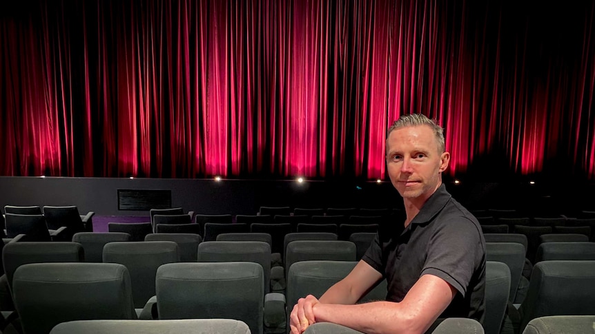Kristian Connelly sits in Cinema Nova in Melbourne.