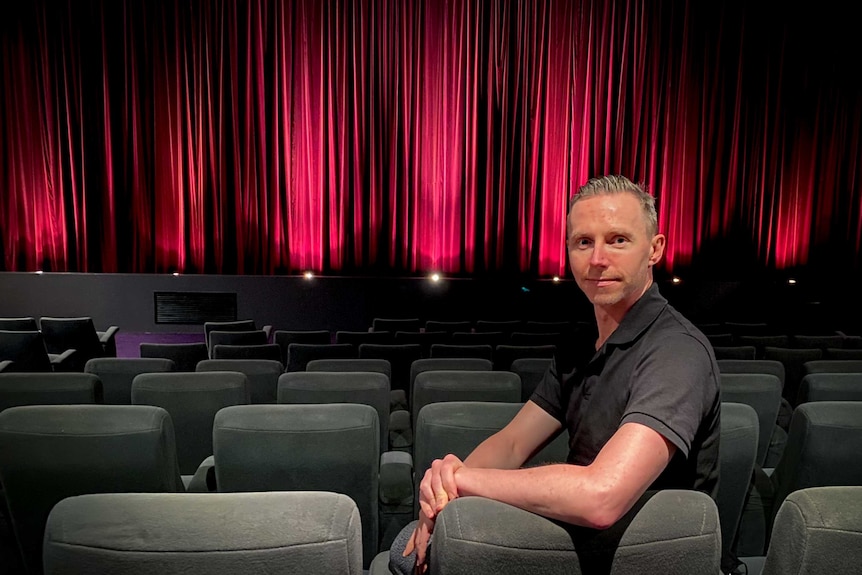 Kristian Connelly sits in Cinema Nova in Melbourne.