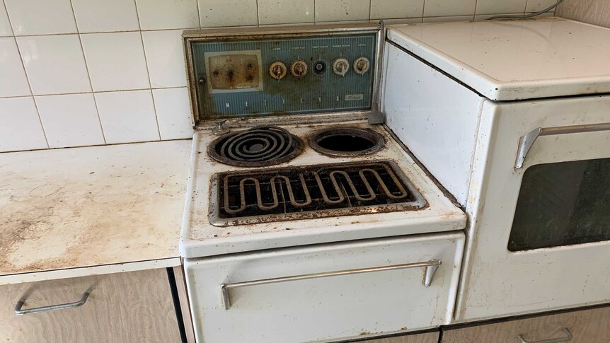 a dirty and charred stove