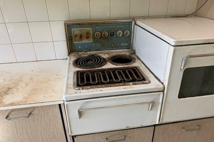 a dirty and charred stove