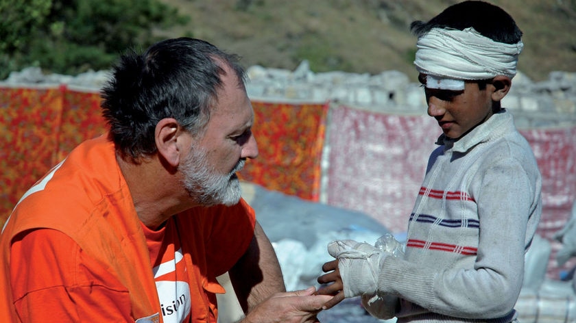 disaster exhibition man helps young boy