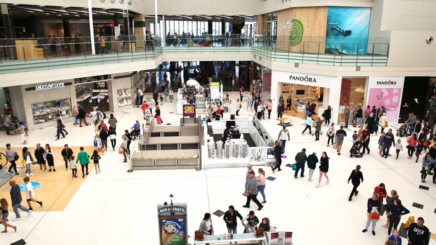 A wide shot of shops and shoppers in the Lakeside Joondalup shopping centre in Perth's north.