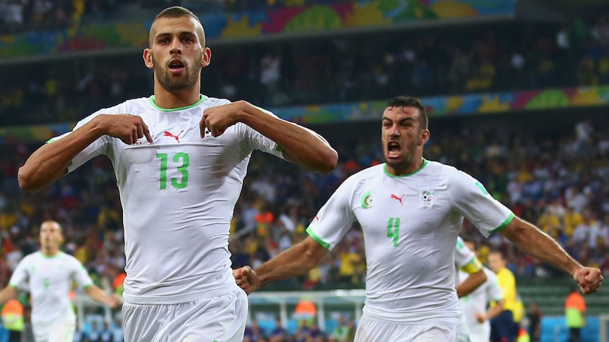 Slimani puts Algeria through to next round