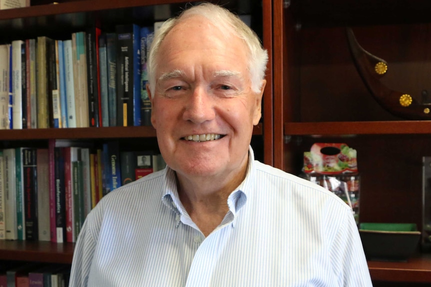 A head and shoulders shot of a smiling Professor Alan Bittles.