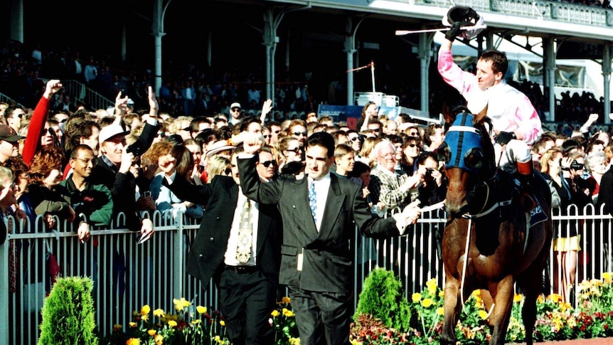 Might and Power, Jim Cassidy and the sons of owner Nick Moraitis after the 1997 Caulfield Cup.