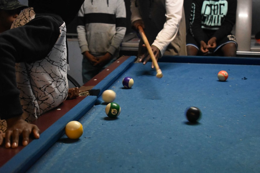 Kids play pool at the youth centre in Alice Springs