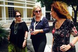 Delia Lawrie (centre) walks from the NT Supreme Court in Darwin during a break.