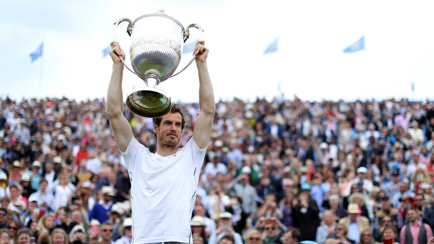 Andy Murray holds aloft the Queens trophy