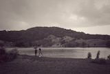 Journalist Jade Macmillan reporting from Tweed River at Tumbulgum.