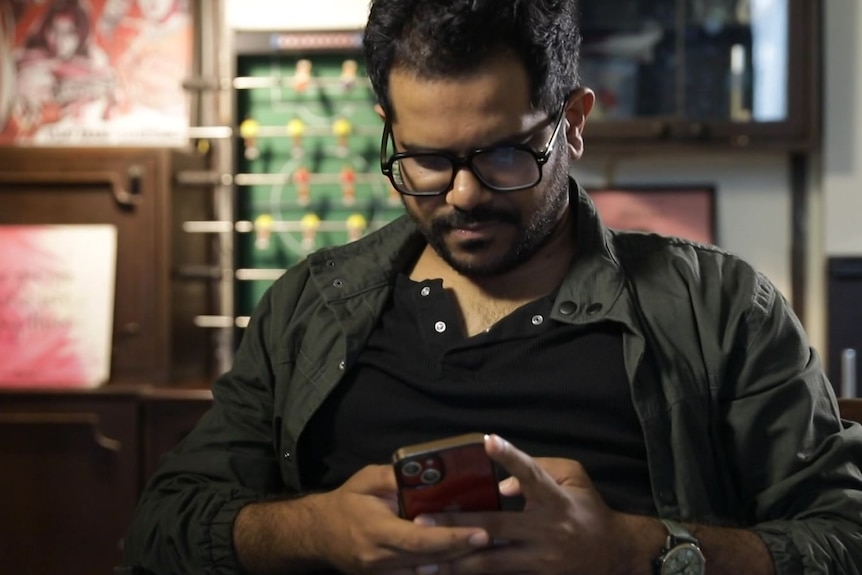 Ankur Pathak on his phone
