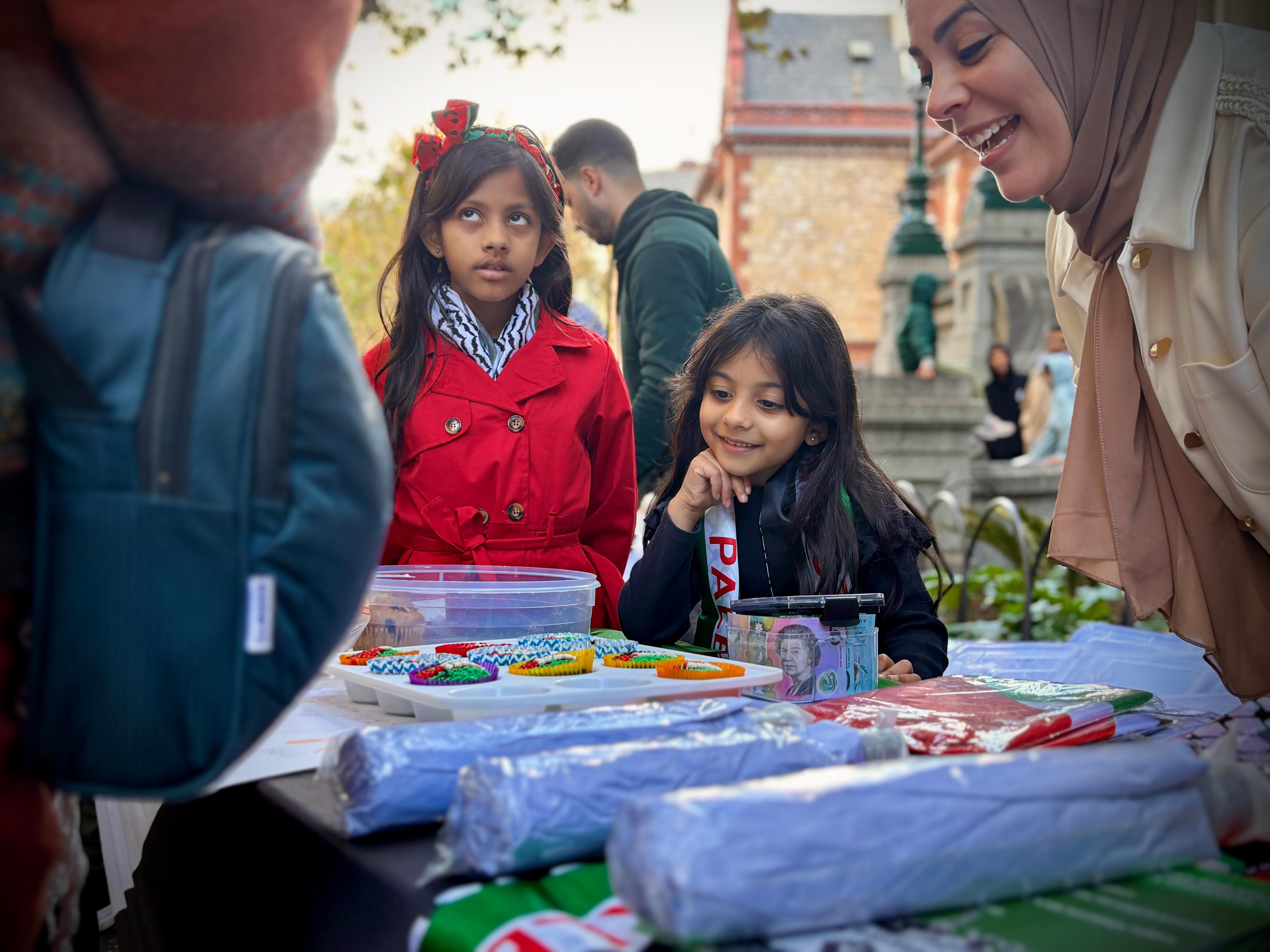 Young girls selling cupcake at the Adelaide Nakba event.